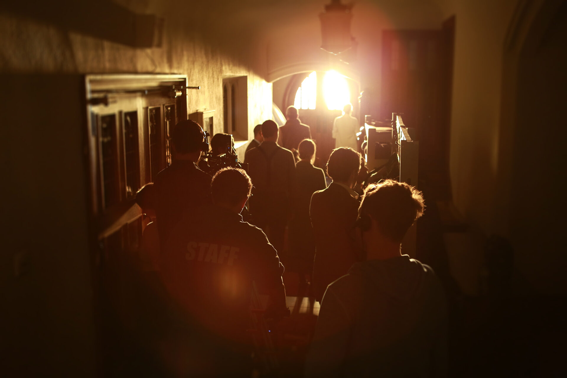 Filming a scene in a sunny hallway