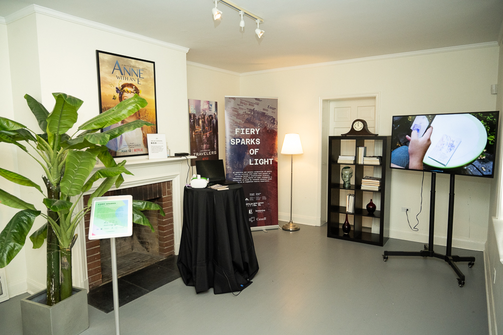 A room setup with screens and pull up banners